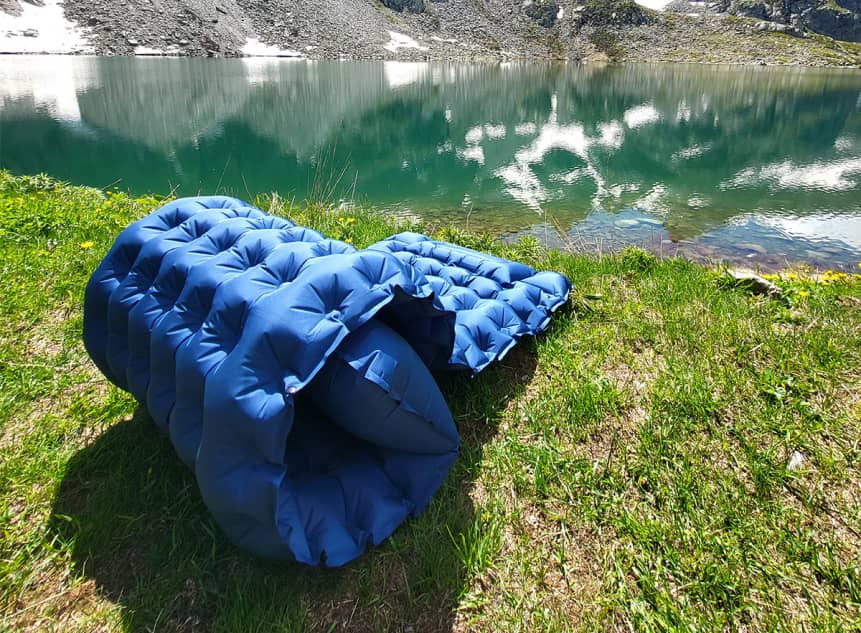 AirFlex pad rolled up by a mountain lake Image